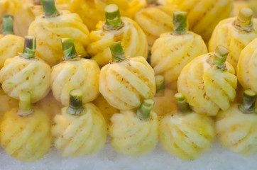 Ripe pineapple peeled on the ice