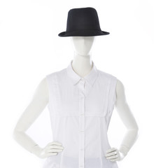 female clothing in black hat on mannequin