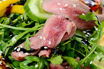 Warm salad with a cutting of a lamb