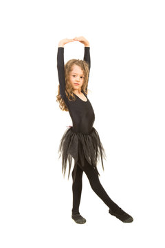 Little dancer girl stretching hands
