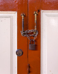 master key on wood door and key knob