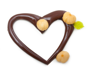 Chocolate heart with nuts on a white background