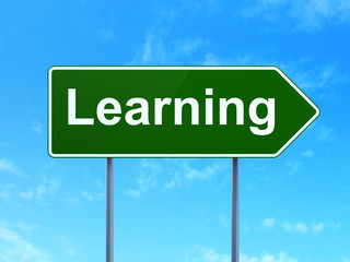 Education concept: Learning on road sign background