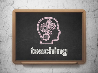 Education concept: Head With Gears and Teaching on chalkboard