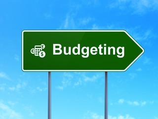 Finance concept: Budgeting and Calculator on road sign