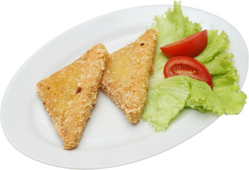 Cooked cheese served with leaf salad
