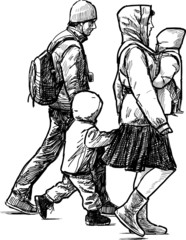 walking young family