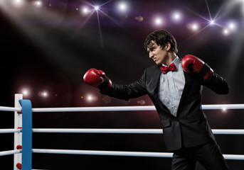 businessman with boxing gloves in the ring