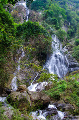 Waterfall in deep rain forest jungle