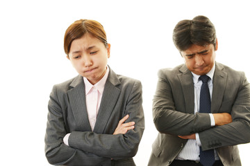 苦悩するビジネスマンとOL