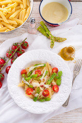 Noodles with asparagus in cream-cheese sauce