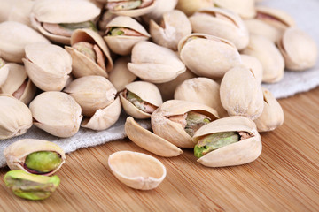 Pistachio nuts on fabric background