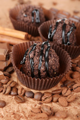 Delicious chocolates on table close-up