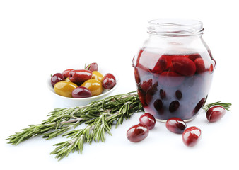 Tasty olives in glass jar, isolated on white