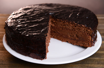 Delicious chocolate cake on table close-up