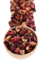 Dry tea in bowl isolated on white