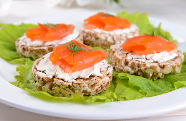 Delicious canapes on table close-up
