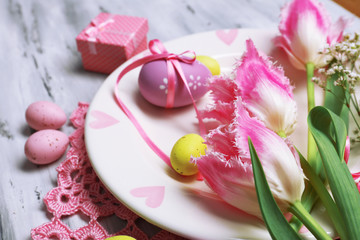 Easter table setting with tulips and eggs