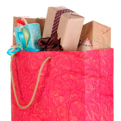 Presents in paper bag isolated on white