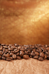 Coffee beans on table on brown background