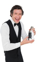 Naklejka premium Bartender using cocktail shaker against white background