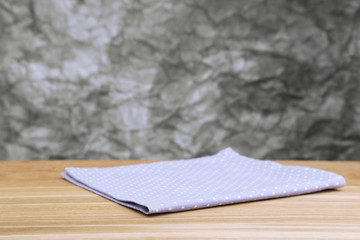 Background with wooden table and tablecloth