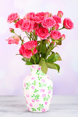 Beautiful small pink roses, on light background