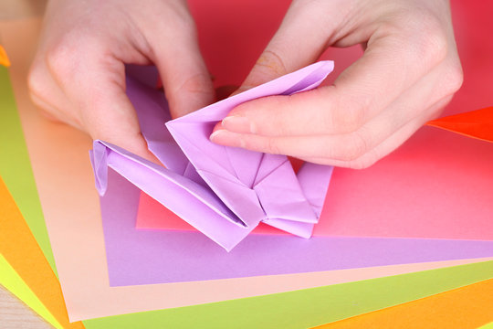 Hands Making Origami Crane, Close Up