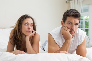 Couple not talking after an argument in bed