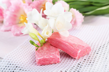 Composition with beautiful  flowers and soap