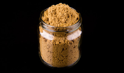 Korma spice powder on black background