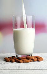 Almond milk is poured into glass,