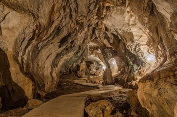 pathway underground cave in Laos, with stalagmites and stalactit