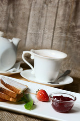 Toasts with powdered sugar and strawberry jam
