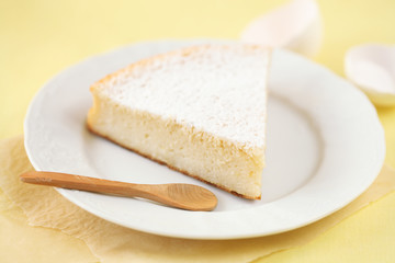 Piece of Milk Cake on a white plate