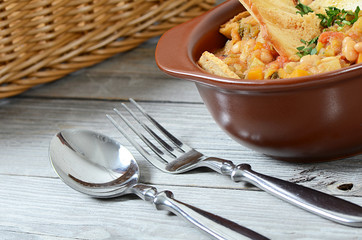 Soup from vegetables and a string bean with dried grain chips