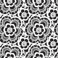 White lace seamless pattern with flowers on black background