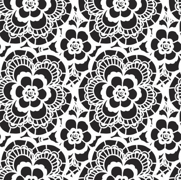 White lace seamless pattern with flowers on black background