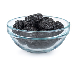 Some prunes in plate isolated on white