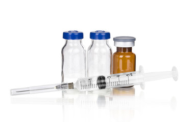 medical ampoules and syringe isolated on white
