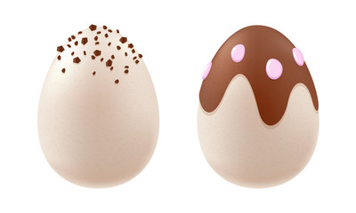 Chocolate eggs of white and dark chocolate with sprinkles.