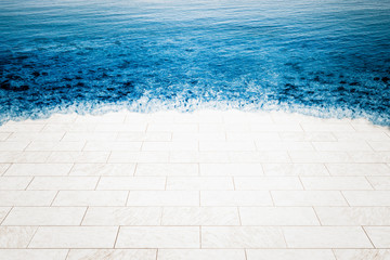 Marble floor being flooded by sea, climate change