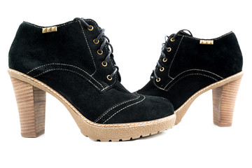 Women's boots with black suede on a white background