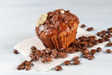 Chocolate muffin with chocolate and coffee beans