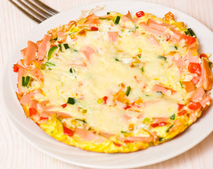 eggs with vegetables, ham and cheese