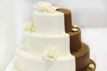 Delicious beautiful wedding cake in white and brown.