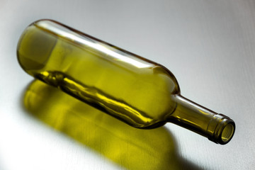 Fototapeta premium Green bottle on the table