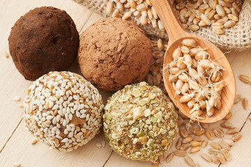 macrobiotic healthy food: balls from ground wheat sprouts with s - obrazy, fototapety, plakaty
