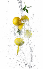 Pieces of lemons in water splash