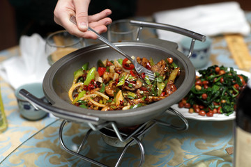 Person takes frog legs